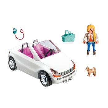 Convertible with woman and puppy