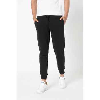 Pantaloni sport conici cu buzunare oblice