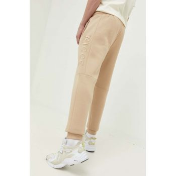 Nicce pantaloni de trening culoarea bej, cu imprimeu