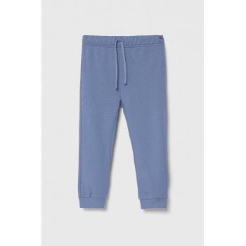 United Colors of Benetton pantaloni de trening din bumbac pentru copii culoarea violet, melanj