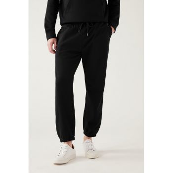 Pantaloni sport lejeri cu buzunare laterale