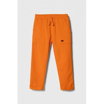 United Colors of Benetton pantaloni de trening pentru copii culoarea portocaliu, neted