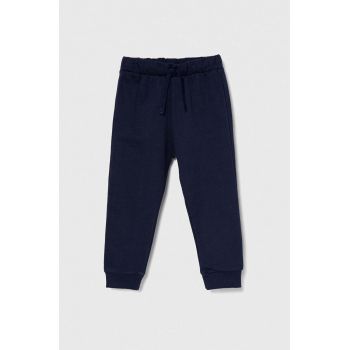 United Colors of Benetton pantaloni de trening din bumbac pentru copii culoarea albastru marin, neted