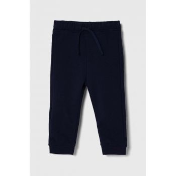 United Colors of Benetton pantaloni de trening din bumbac pentru copii culoarea albastru marin