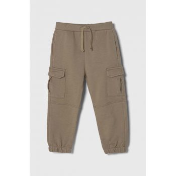 United Colors of Benetton pantaloni de trening din bumbac pentru copii culoarea bej, neted