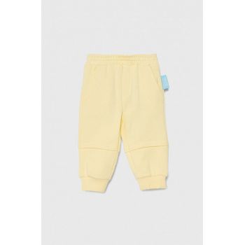 Emporio Armani pantaloni de trening din bumbac pentru bebeluși x The Smurfs culoarea galben, neted