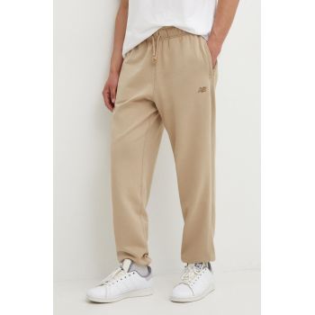 New Balance pantaloni de trening din bumbac culoarea bej, neted