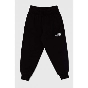 The North Face pantaloni de trening din bumbac pentru copii OVERSIZED JOGGERS culoarea negru, neted