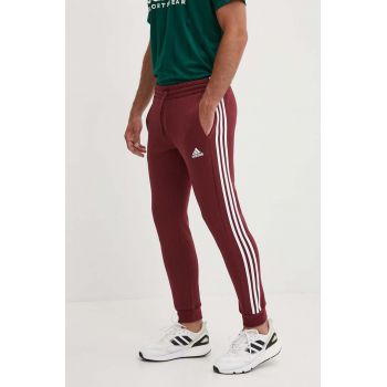 adidas pantaloni de trening Essentials culoarea bordo, cu imprimeu, JG5951