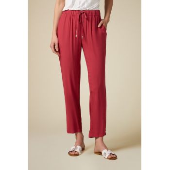 Pantaloni conici cu buzunare laterale