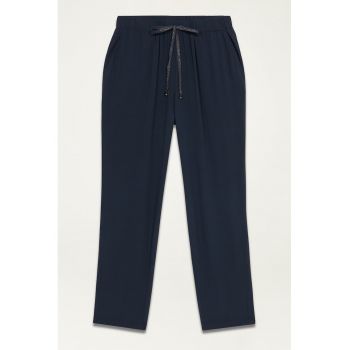 Pantaloni conici cu buzunare laterale