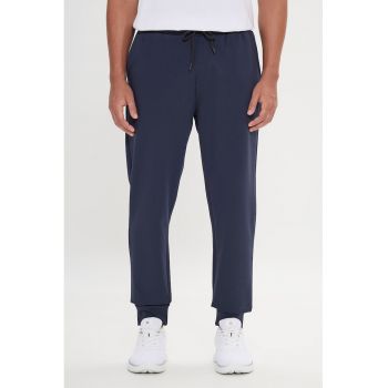 Pantaloni de trening uni cu buzunare laterale