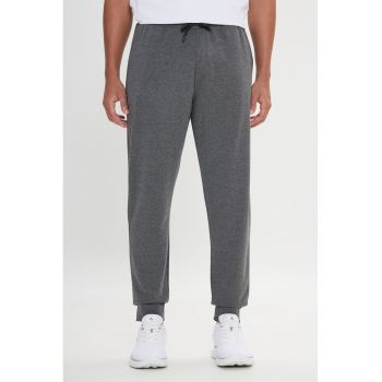 Pantaloni de trening uni cu buzunare laterale