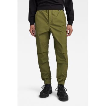 Pantaloni conici cu buzunare oblice