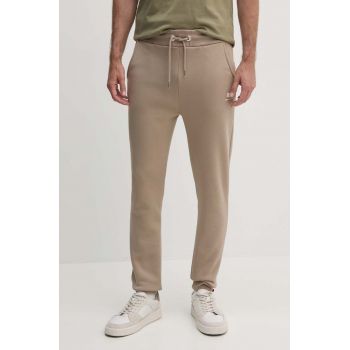 Alpha Industries pantaloni de trening culoarea bej, neted