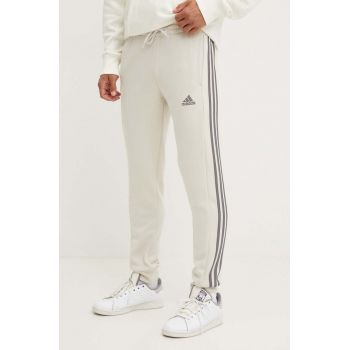 adidas pantaloni de trening Essentials culoarea bej, cu imprimeu, JG5952