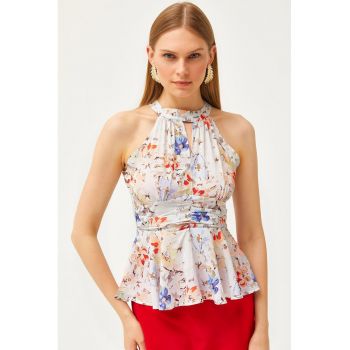 Top cu terminatie peplum si imprimeu