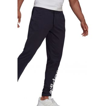 Pantaloni sport cu croiala conica si imprimeu logo Essentials