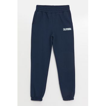 Pantaloni de trening cu buzunare oblice