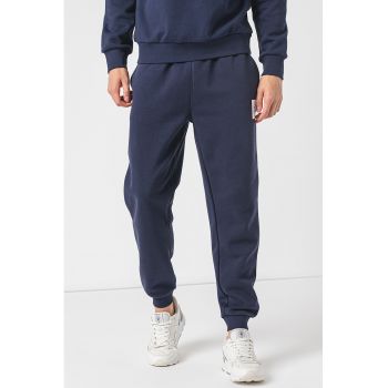 Pantaloni de trening conici cu buzunare oblice