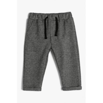 Pantaloni conici cu talie elastica