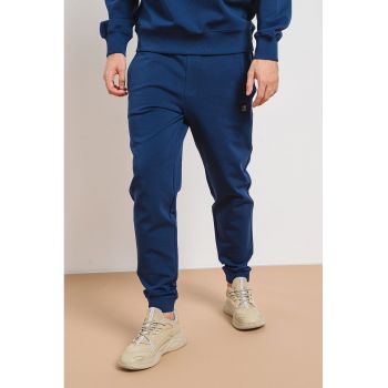 Pantaloni de trening cu snur de ajustare si croiala conica