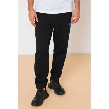 Pantaloni de trening de bumbac cu buzunare laterale