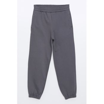 Pantaloni de trening conici cu buzunare laterale