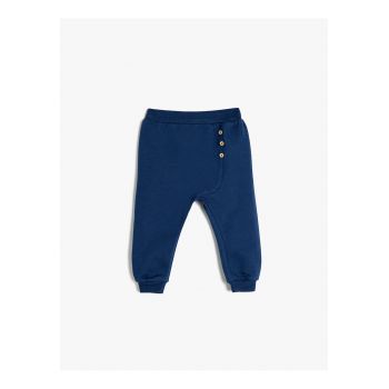 Pantaloni de trening cu nasturi decorativi