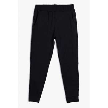 Pantaloni conici de trening cu talie elastica