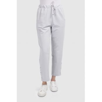 Pantaloni crop cu slituri cu capse