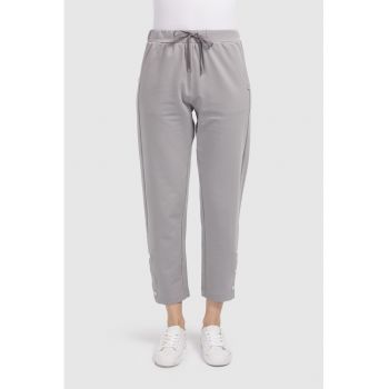 Pantaloni crop cu slituri cu capse