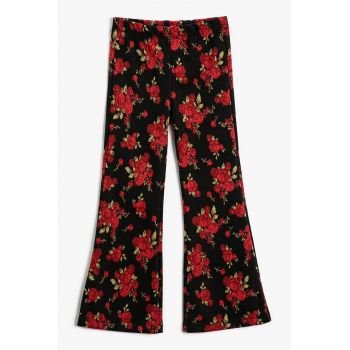 Pantaloni evazati cu model floral