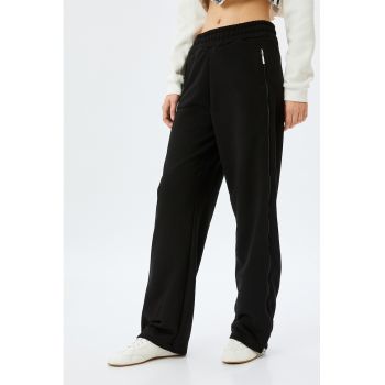 Pantaloni relaxed fit de trening cu fermoare laterale