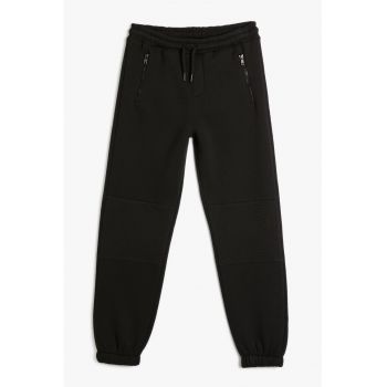 Pantaloni de trening cu buzunare cu fermoar