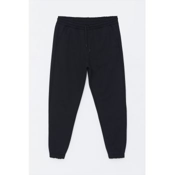 Pantaloni de trening conici cu buzunare oblice